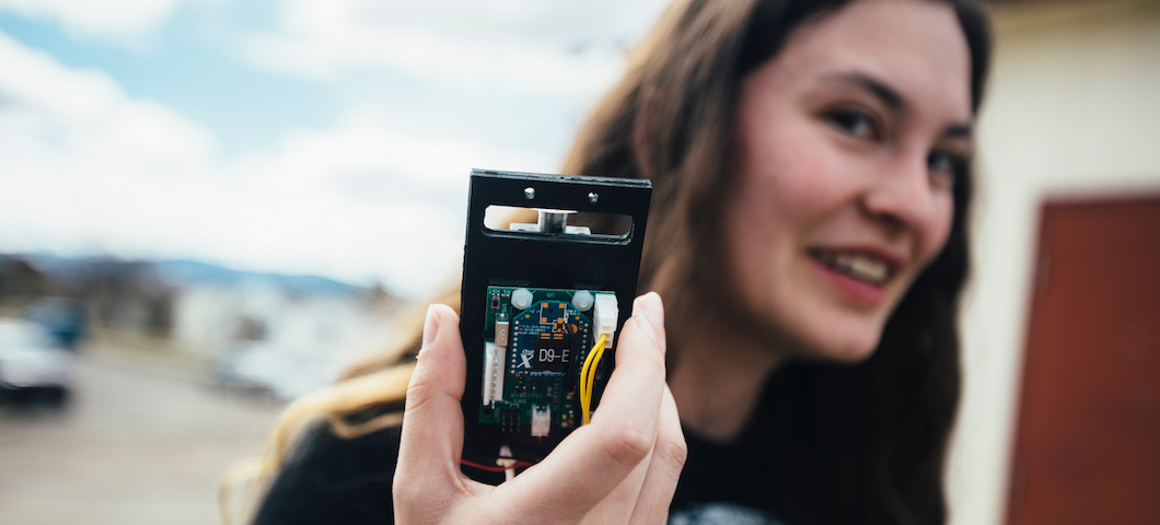 MSU student holding circuit board