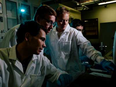 Four MSU students in lab