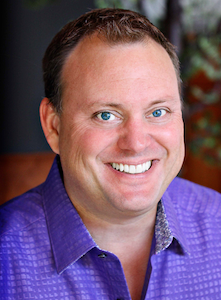 portrait photo of Ryan Parker wearing purple shirt