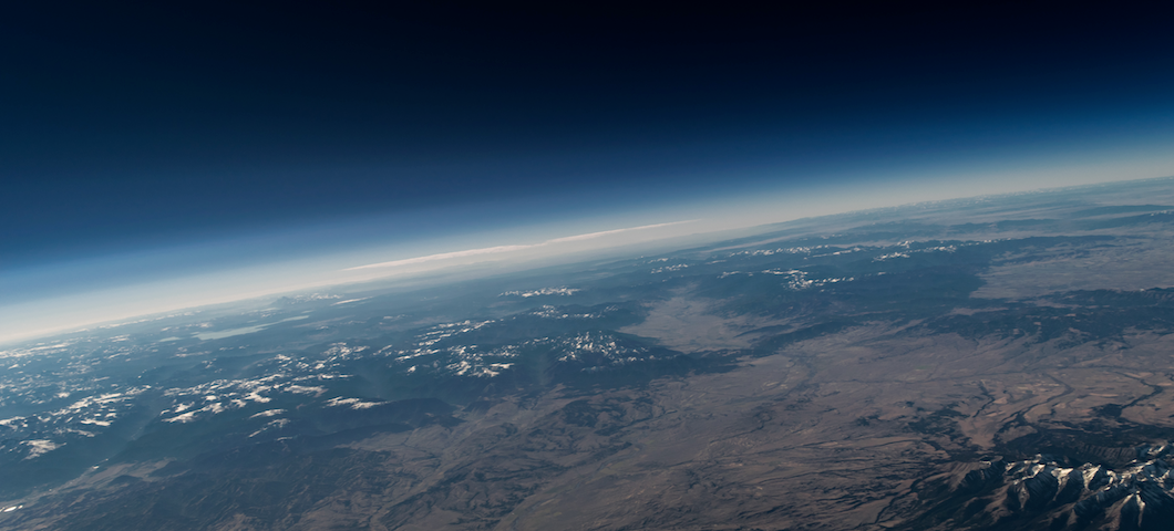 view from high-altitude balloon showing curvature of the Earth and the blackness of space