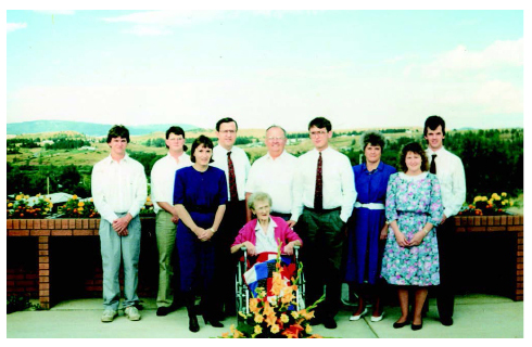 Norm, fourth from left, poses for a photograph with his family in 1990.
